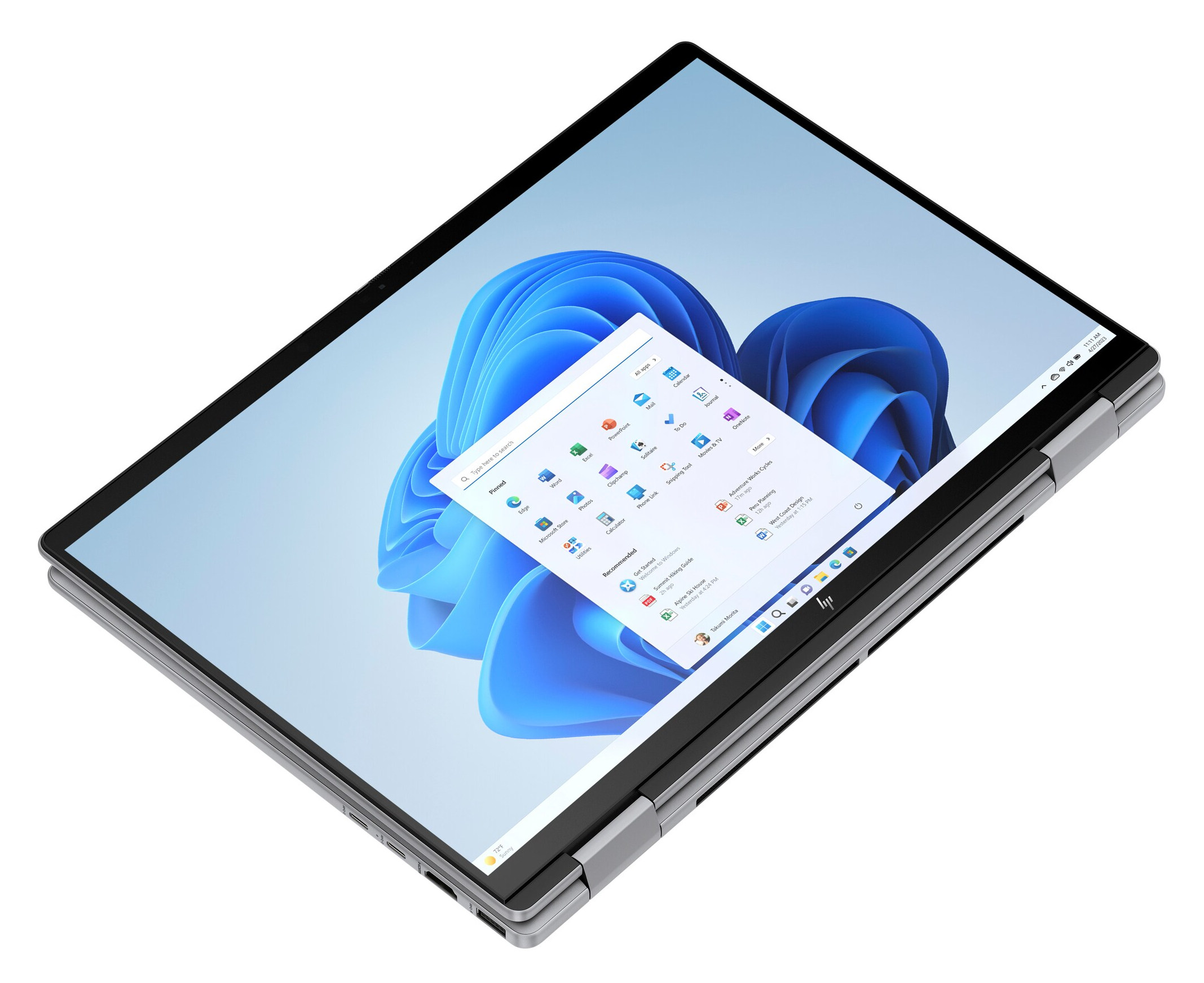 Srebrny laptop z czarnymi ramkami, otwarty. Interfejs Windows 11 z ikonami aplikacji.