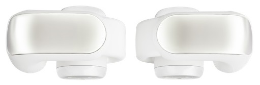 Dwa białe i srebrne słuchawki douszne z białą podstawą.