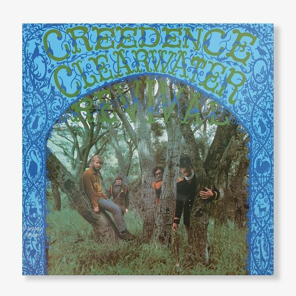 Albumhoes van Creedence Clearwater Revival. Vier mensen in een bos, met bomen en bladeren.
