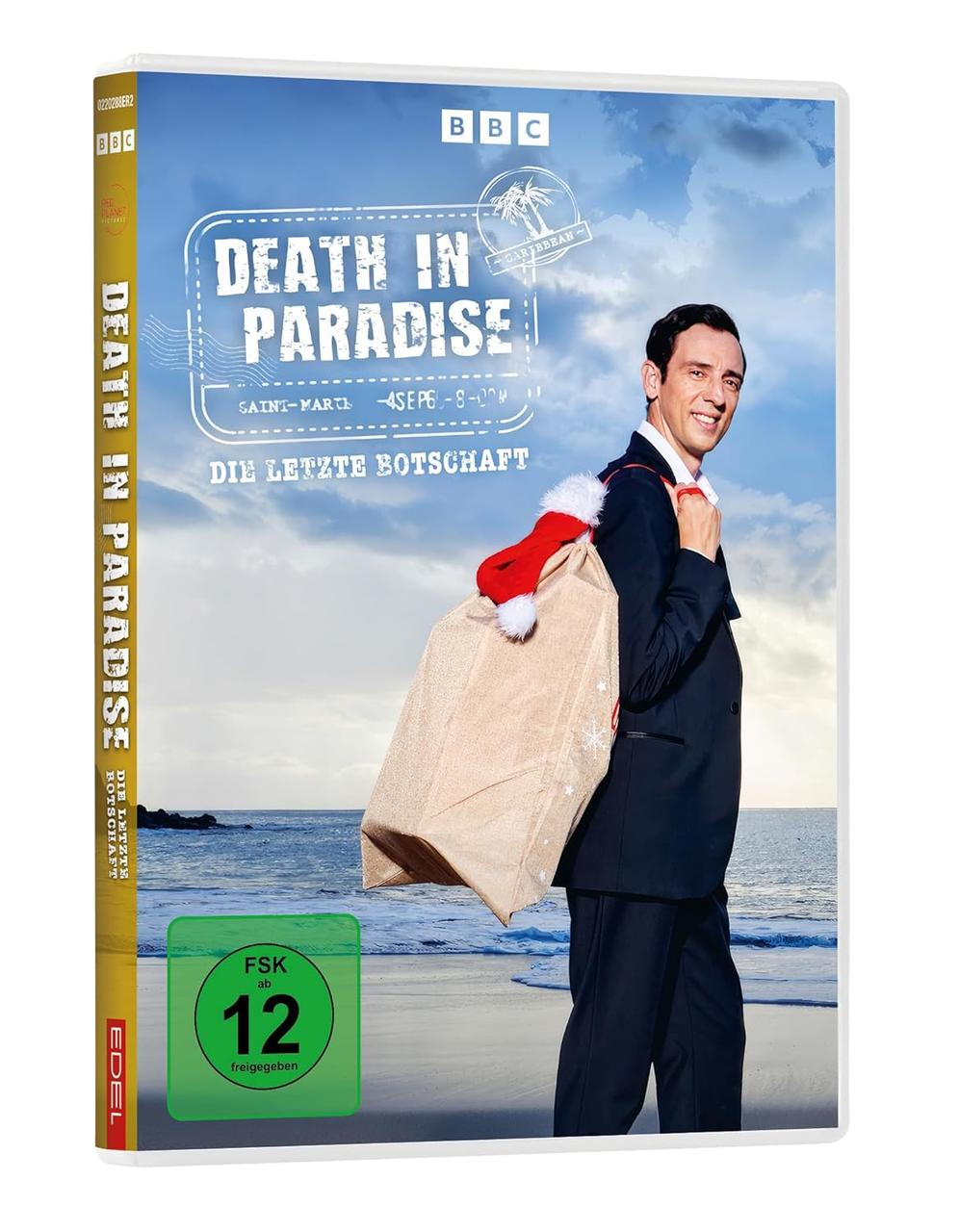 DVD-Hülle für Death in Paradise, mit einem Mann im Anzug, der eine Tasche und eine Weihnachtsmütze trägt.