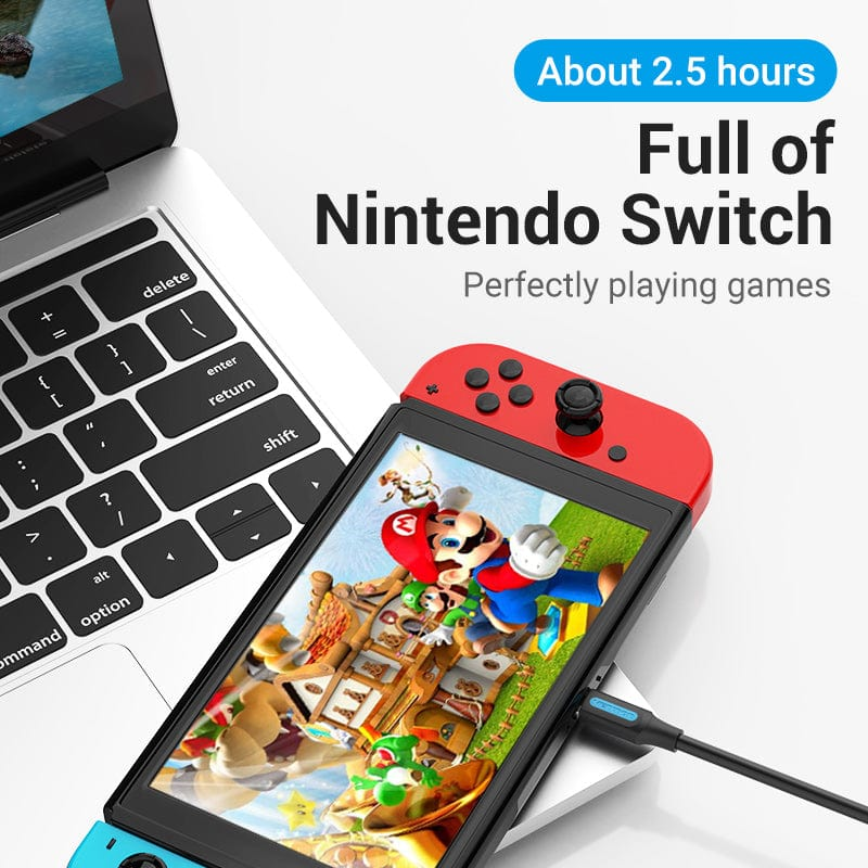 Laptop Nintendo Switchel, kontrollerrel és töltővel. A szöveg átfedésben van.