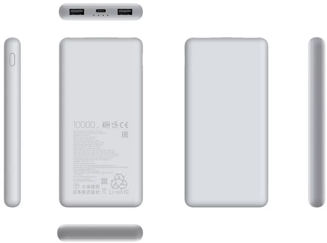 Világosszürke power bank, különböző oldalai láthatóak fehér felületen.