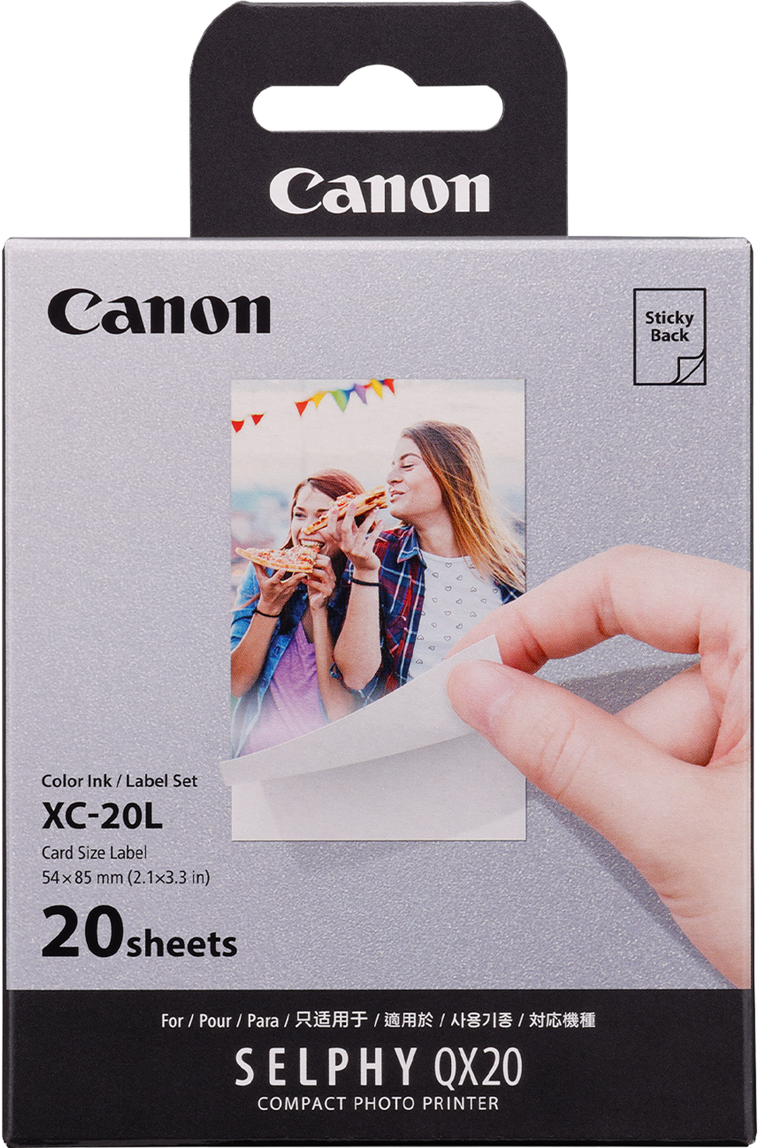 Scatola della stampante fotografica Canon Selphy QX20. Mostra due donne che guardano una foto stampata. 20 fogli.