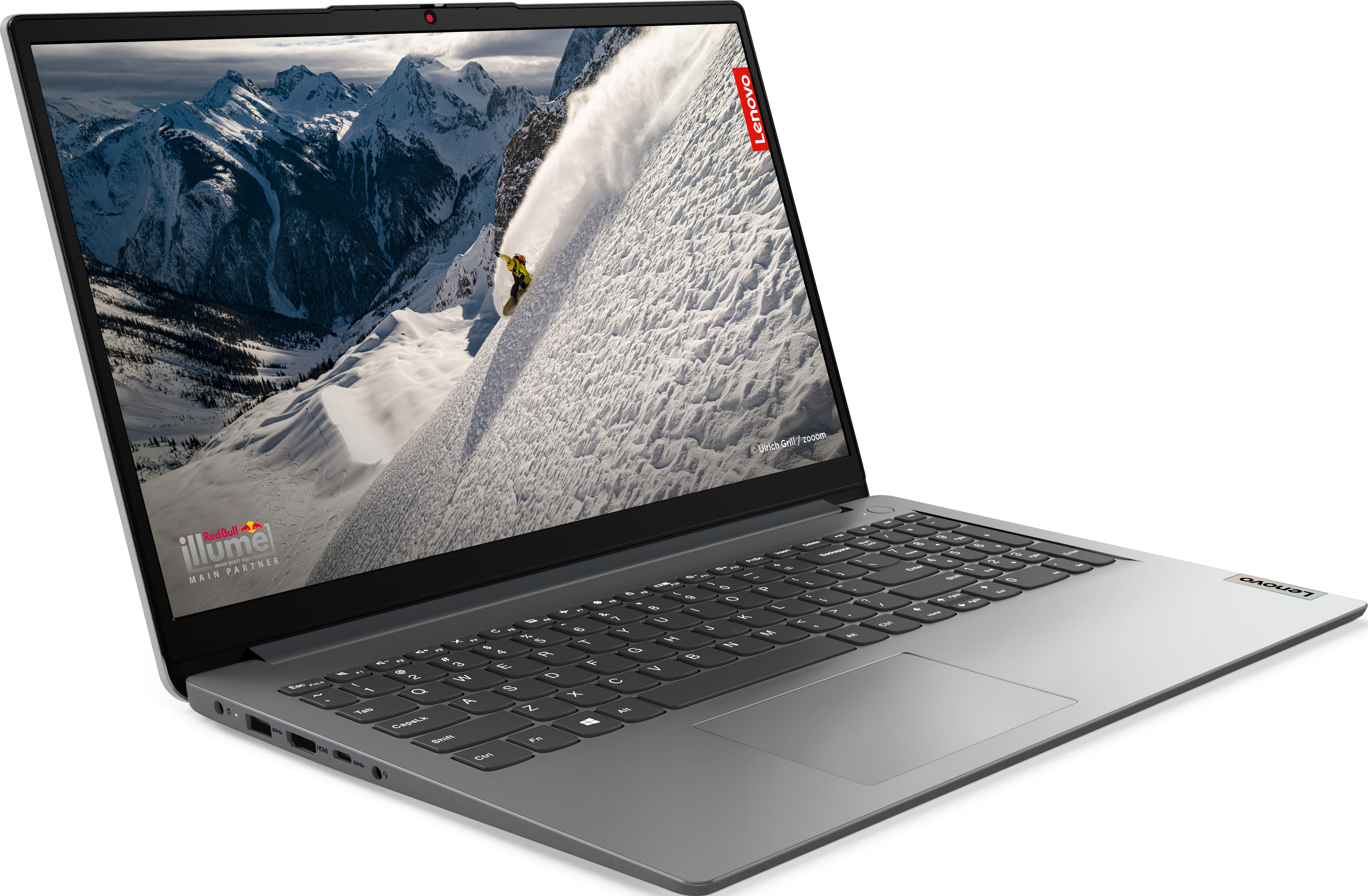 Ordinateur portable avec une scène de montagne, logo Lenovo dans le coin.