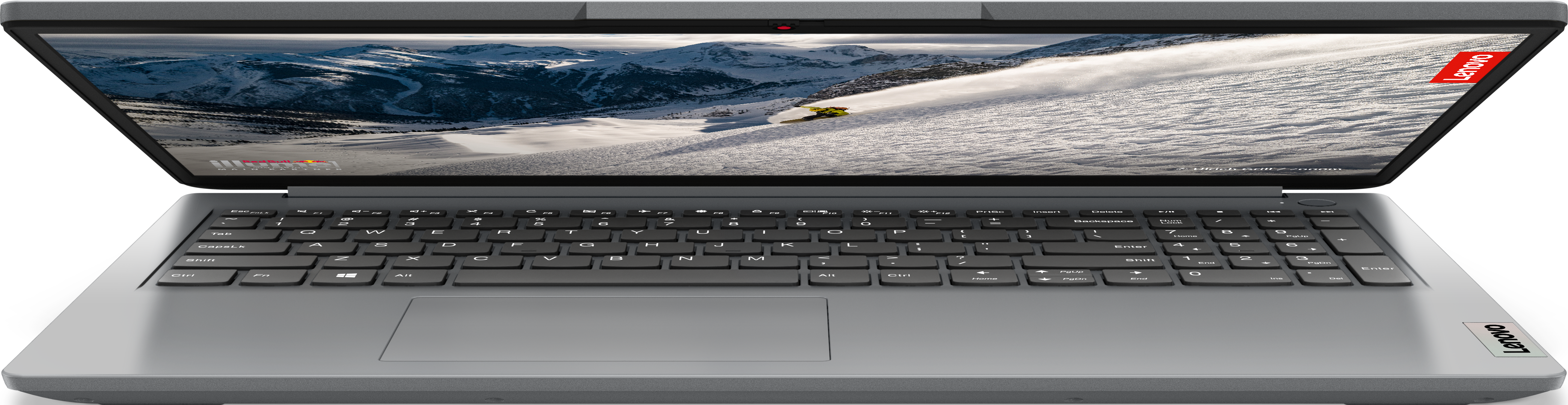 Ordinateur portable argenté ouvert avec scène de montagne enneigée, clavier visible.