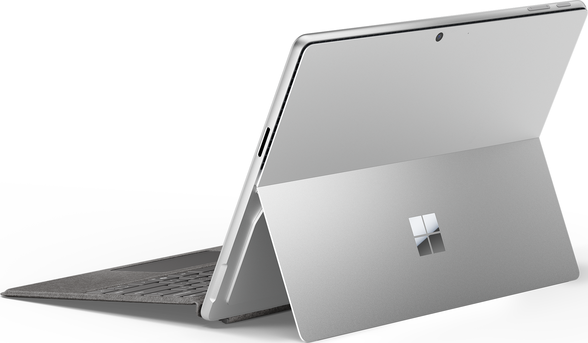 Laptop argentato, aperto, contro uno sfondo nero. Logo Microsoft visibile sul retro.