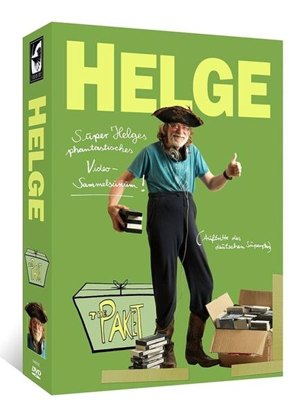 DVD-Box-Set von Helge Schneider auf Grün. Zeigt Helge und eine Box mit der Aufschrift "The Paket".