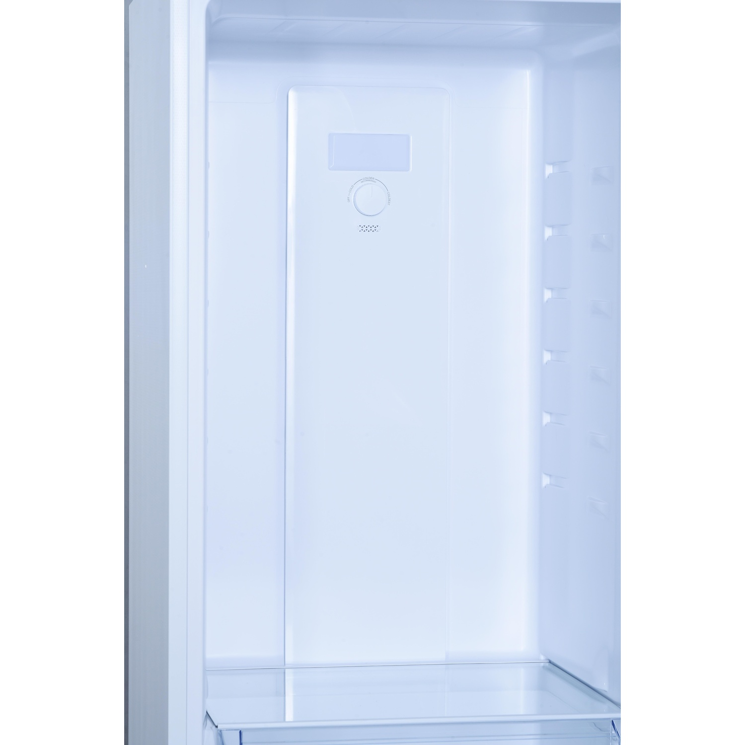 Interno vuoto del frigorifero con ripiani e un cassetto, e un interno azzurro.