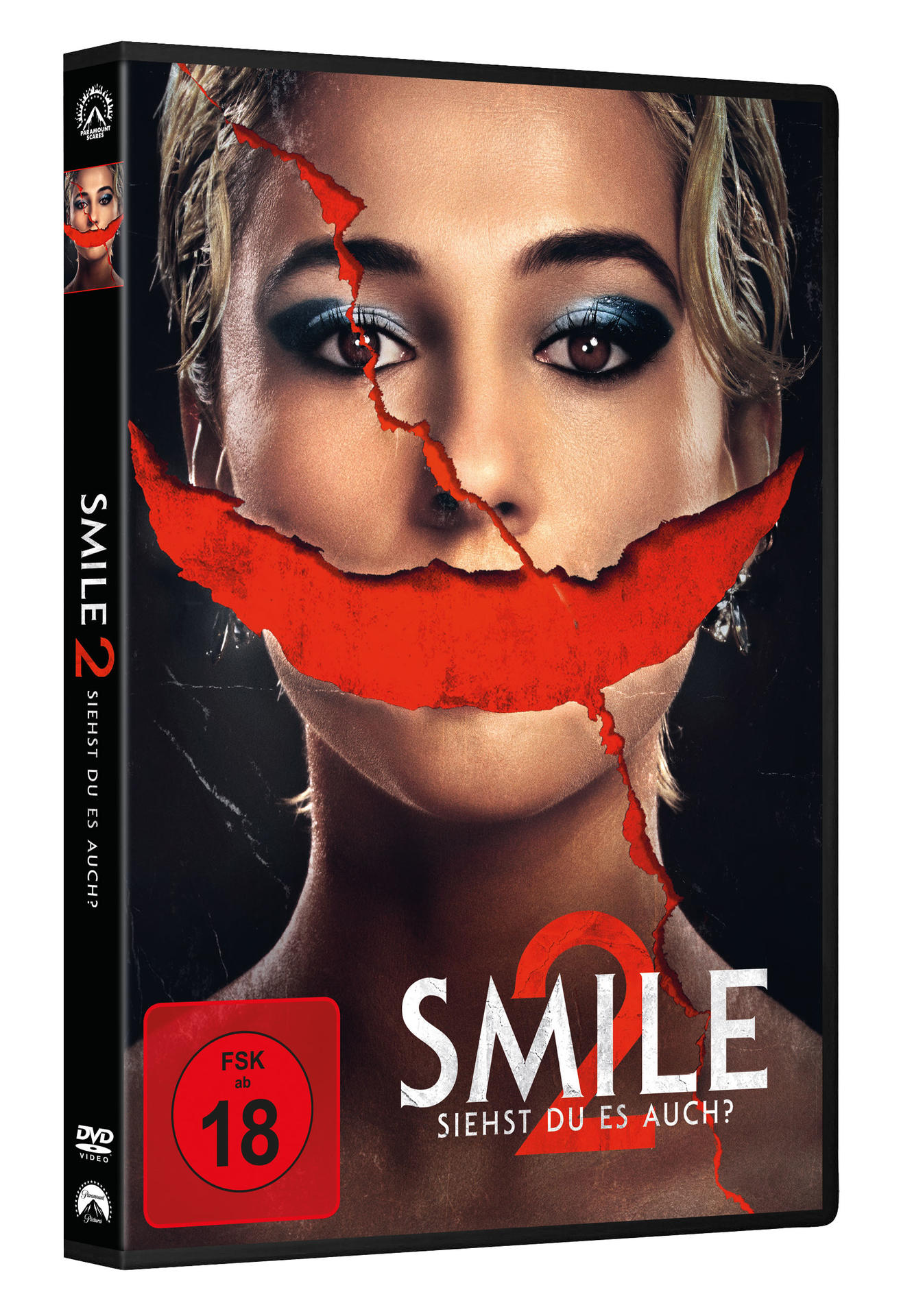 DVD-Hülle für den Film „Smile 2“. Das Gesicht einer Frau mit einem roten, zerrissenen Mund. Der Titel ist weiß.