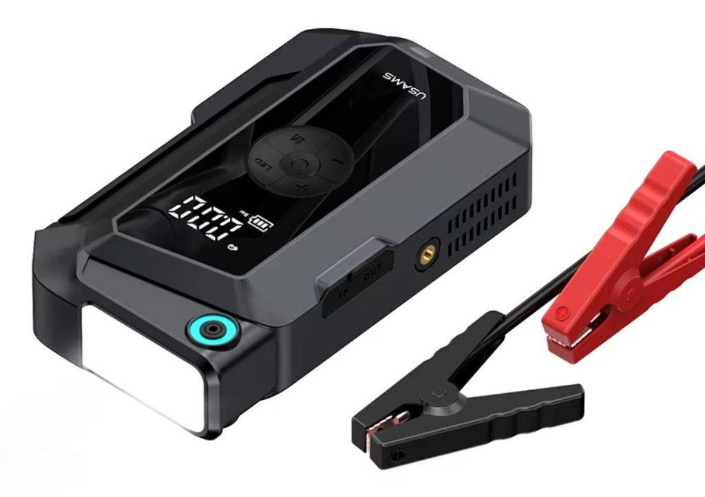 Czarno-szary przenośny rozrusznik samochodowy z zaciskami.