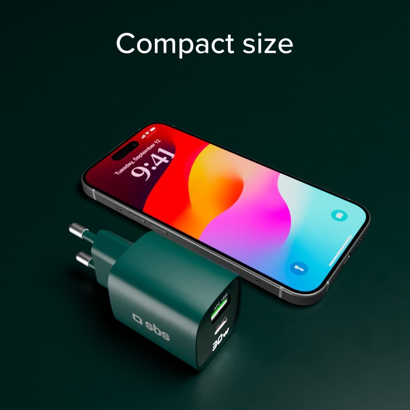 Zielona ładowarka do telefonu obok telefonu z jasnoniebieską i białą tapetą.