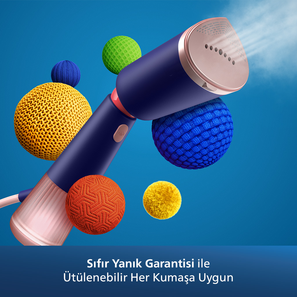 Yakınlarda yüzen renkli kürelerle mavi ve pembe bir buhar makinesi.