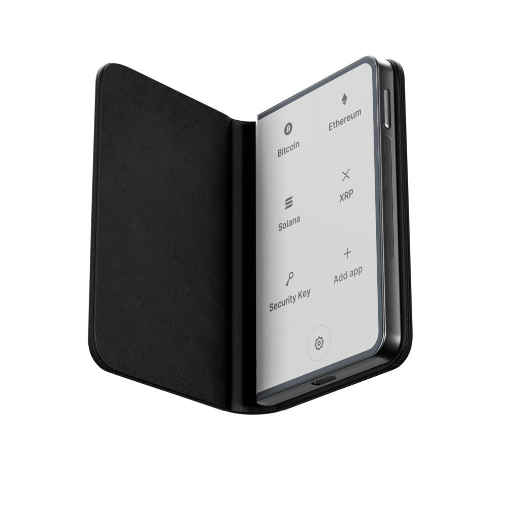 Ein schwarzes, geöffnetes Krypto-Wallet im Ledger-Stil. Der Bildschirm zeigt mehrere Kryptowährungs-Icons und Optionen.