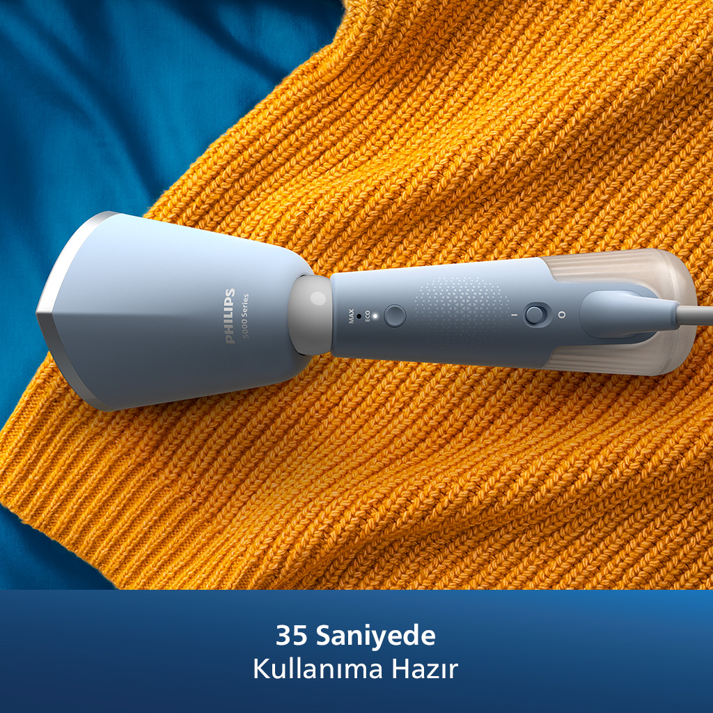 Sarı bir kazak üzerinde Philips el tipi buhar makinesi. Metin: '35 saniye'.