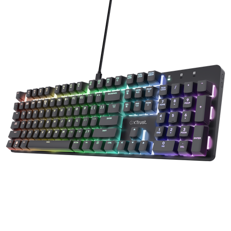 Un teclado retroiluminado negro con teclas de colores. Las teclas son multicolores. El fondo es negro.