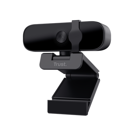 Una webcam Trust negra sobre un soporte, con lente y el logo Trust.