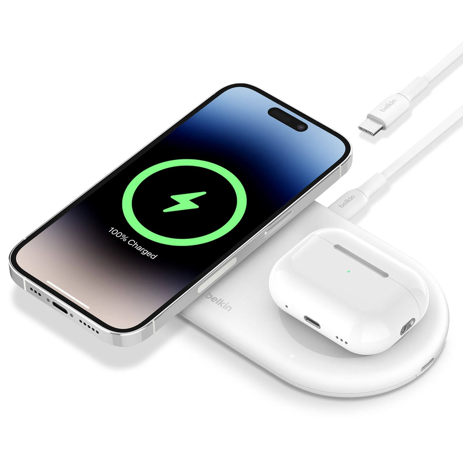 Base de carga blanca con teléfono y auriculares cargando. El teléfono muestra 100% cargado.