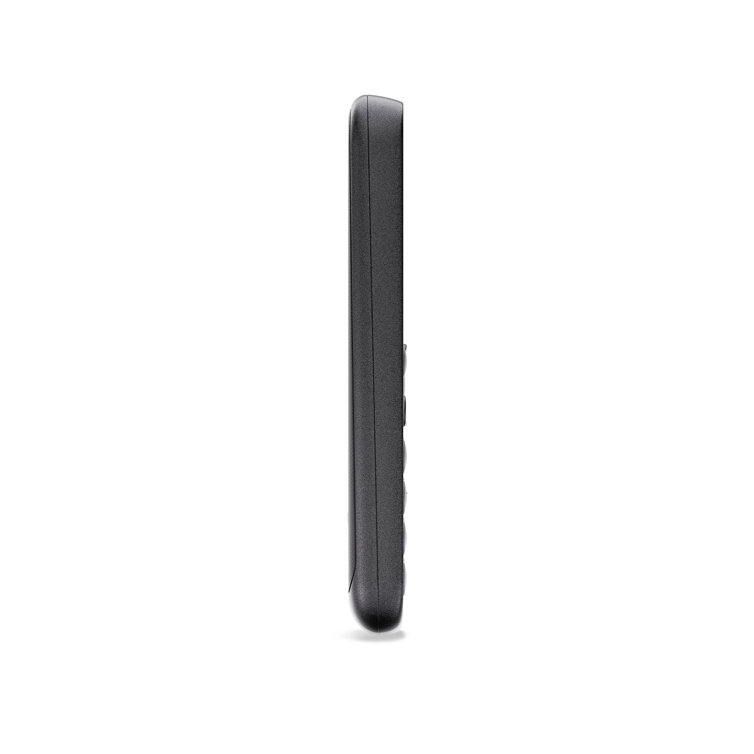 A side view of a black, sleek remote control against a black background.