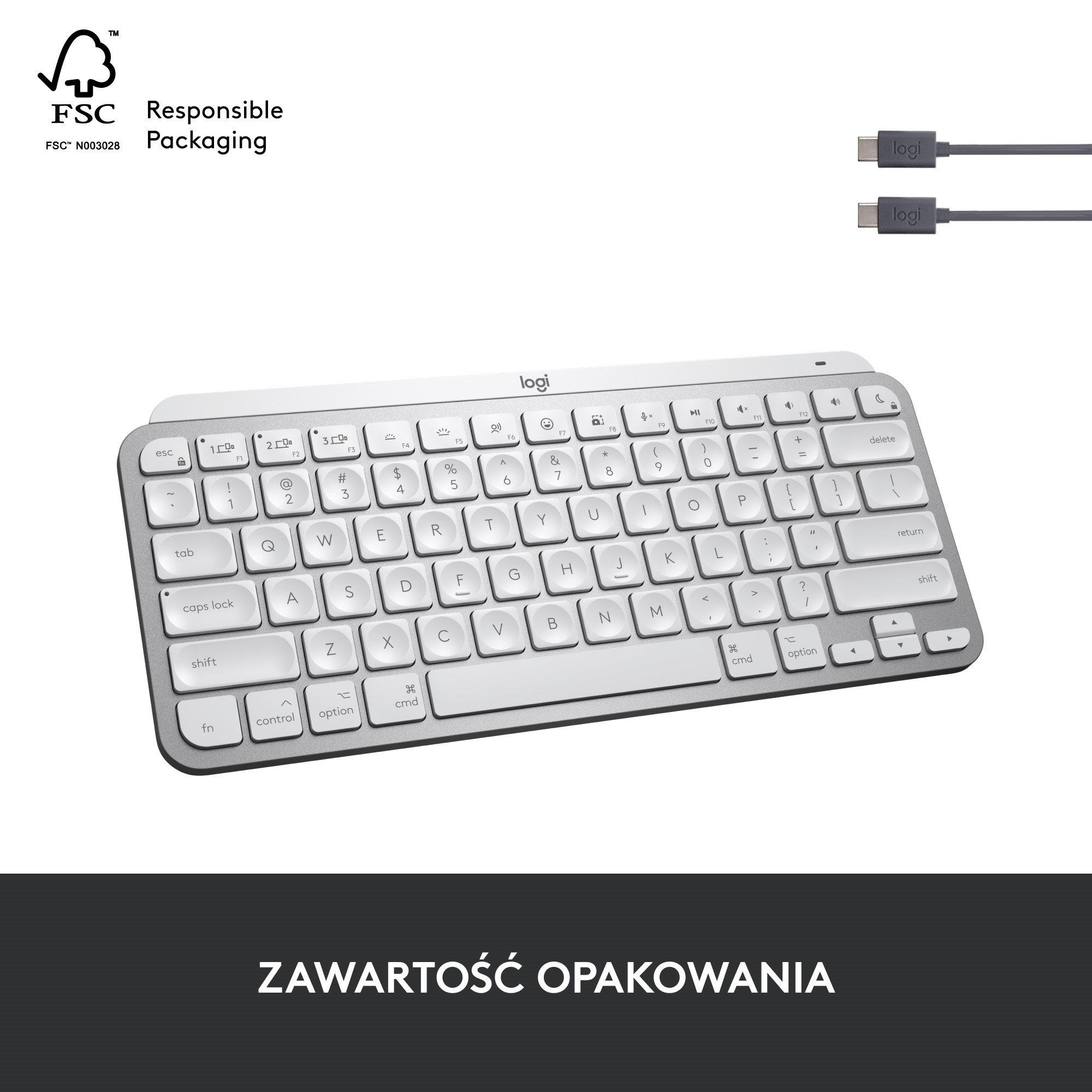 Srebrna klawiatura z białymi klawiszami. Dwa szare kable USB-C w prawym górnym rogu.