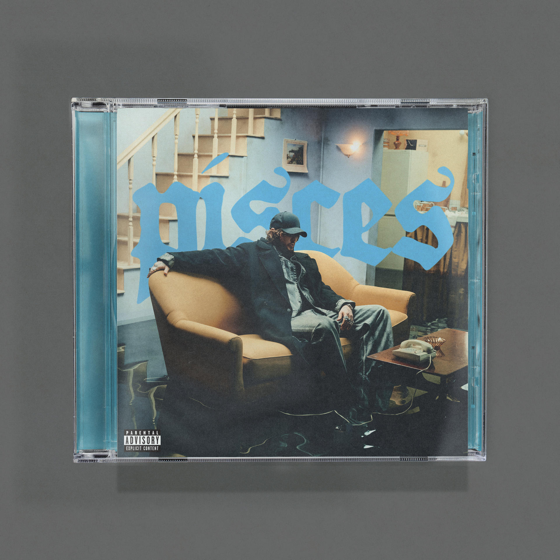 CD-Hülle. Blauer Text 'Mères' auf blauem Hintergrund, ein Mann mit Mütze sitzt im Raum.