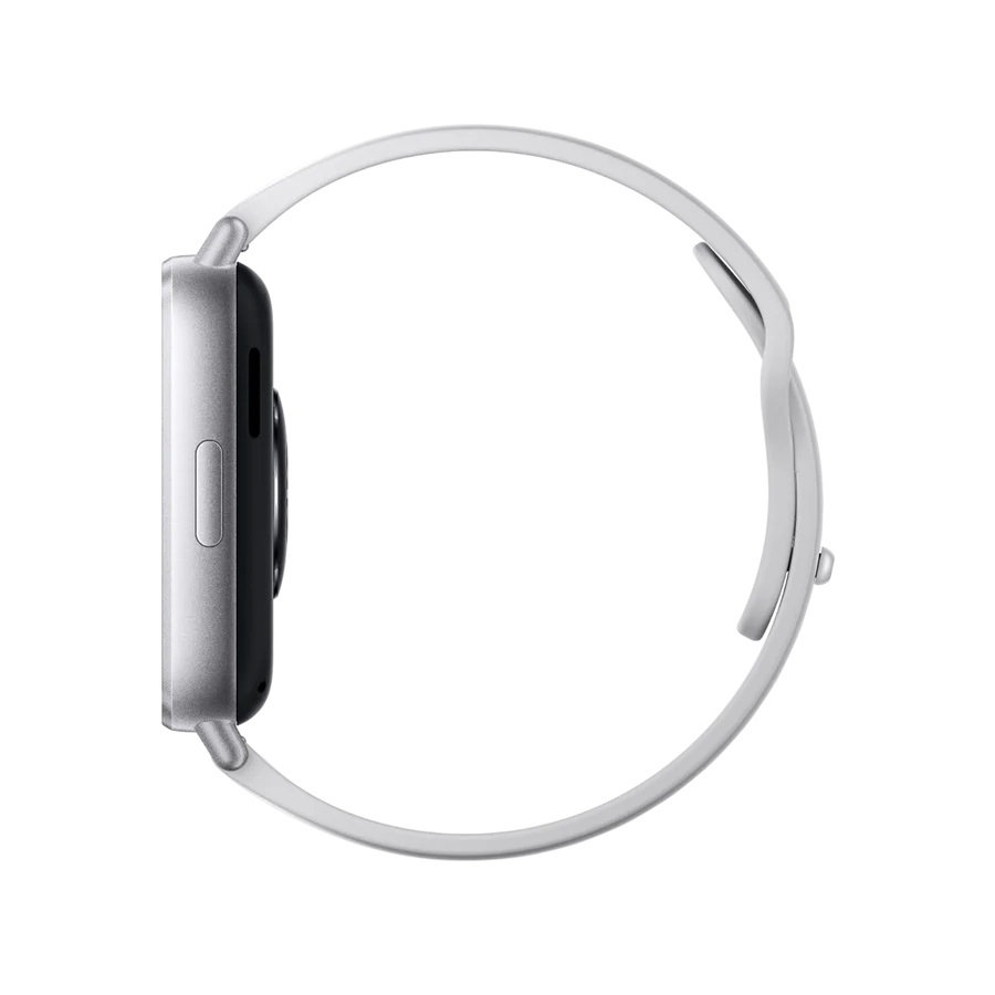 Widok z boku srebrnego smartwatcha z białym paskiem, umieszczonego na białej powierzchni.