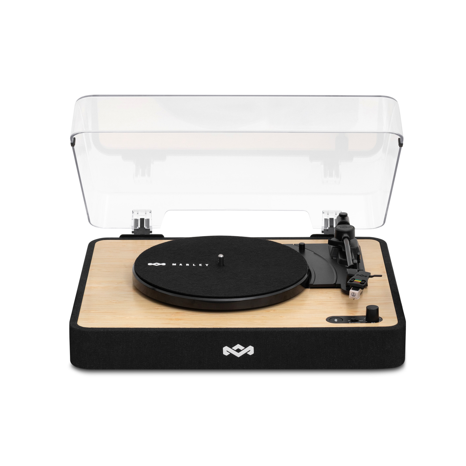 Turntable with a black record, tonearm, and transparent cover, on a bamboo-style base.