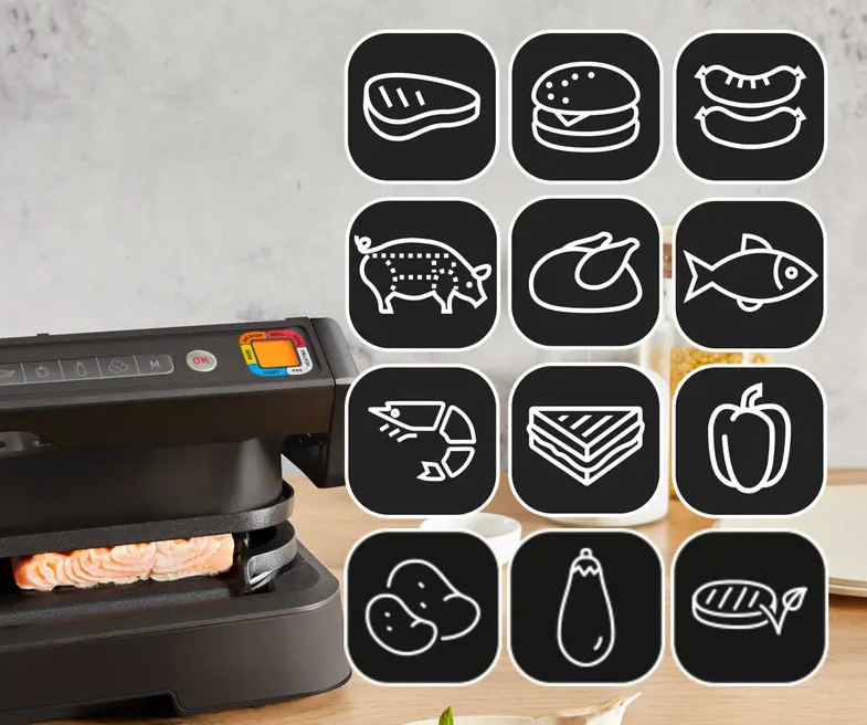Czarny grill z ikonami jedzenia i łososiem. Ikony reprezentują różne potrawy.