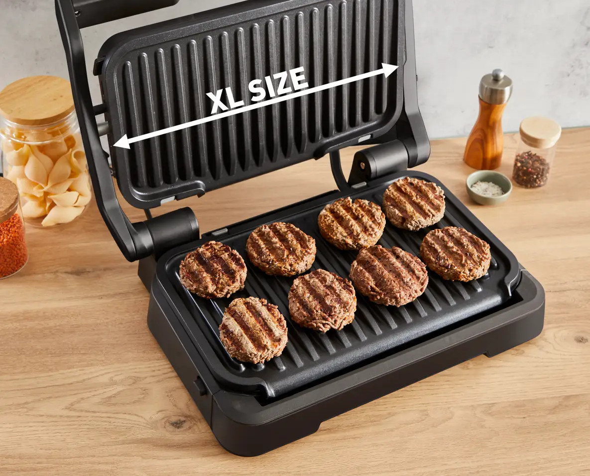 Otwarty grill w rozmiarze XL z ugotowanymi burgerami.