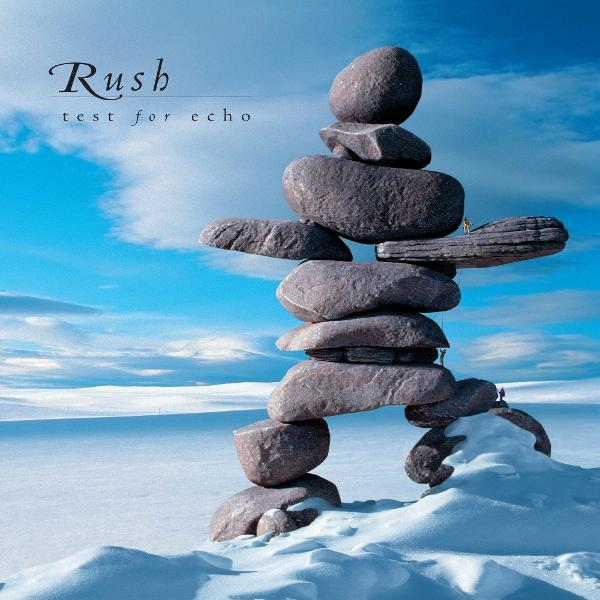 Rush-Albumcover mit gestapelten Felsen auf Schnee mit blauem Himmel, Titel: test for echo.