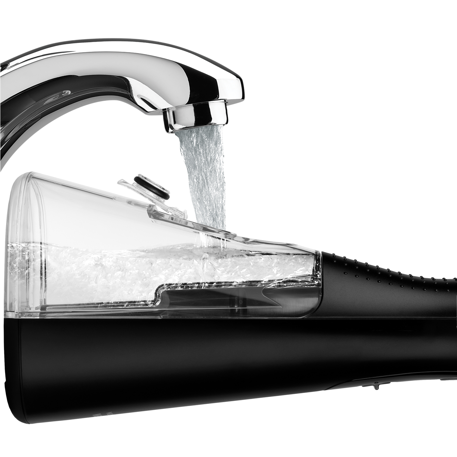 Water flows from a faucet into a clear water flosser reservoir, black handle.