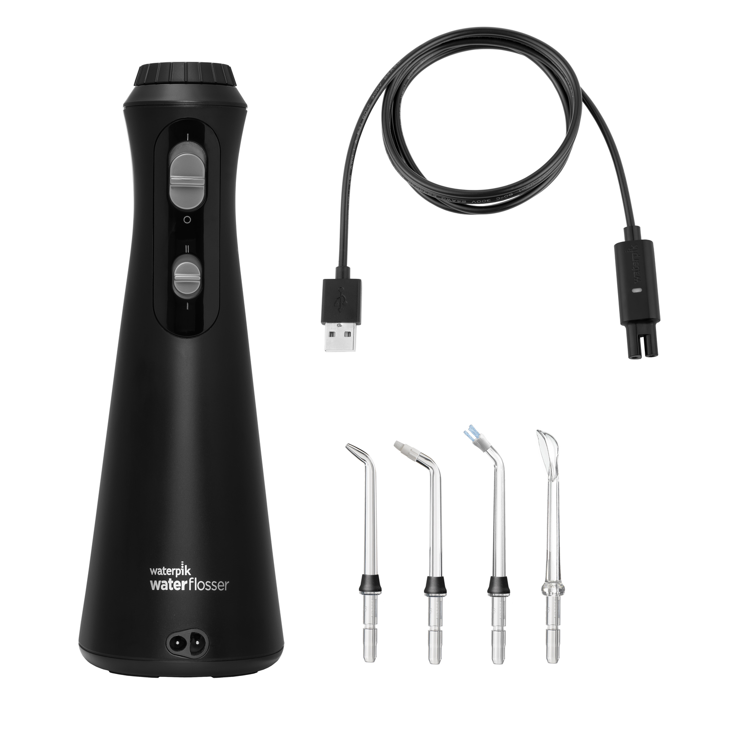 Black water flosser and accessories. USB cable and several flosser tips are visible.