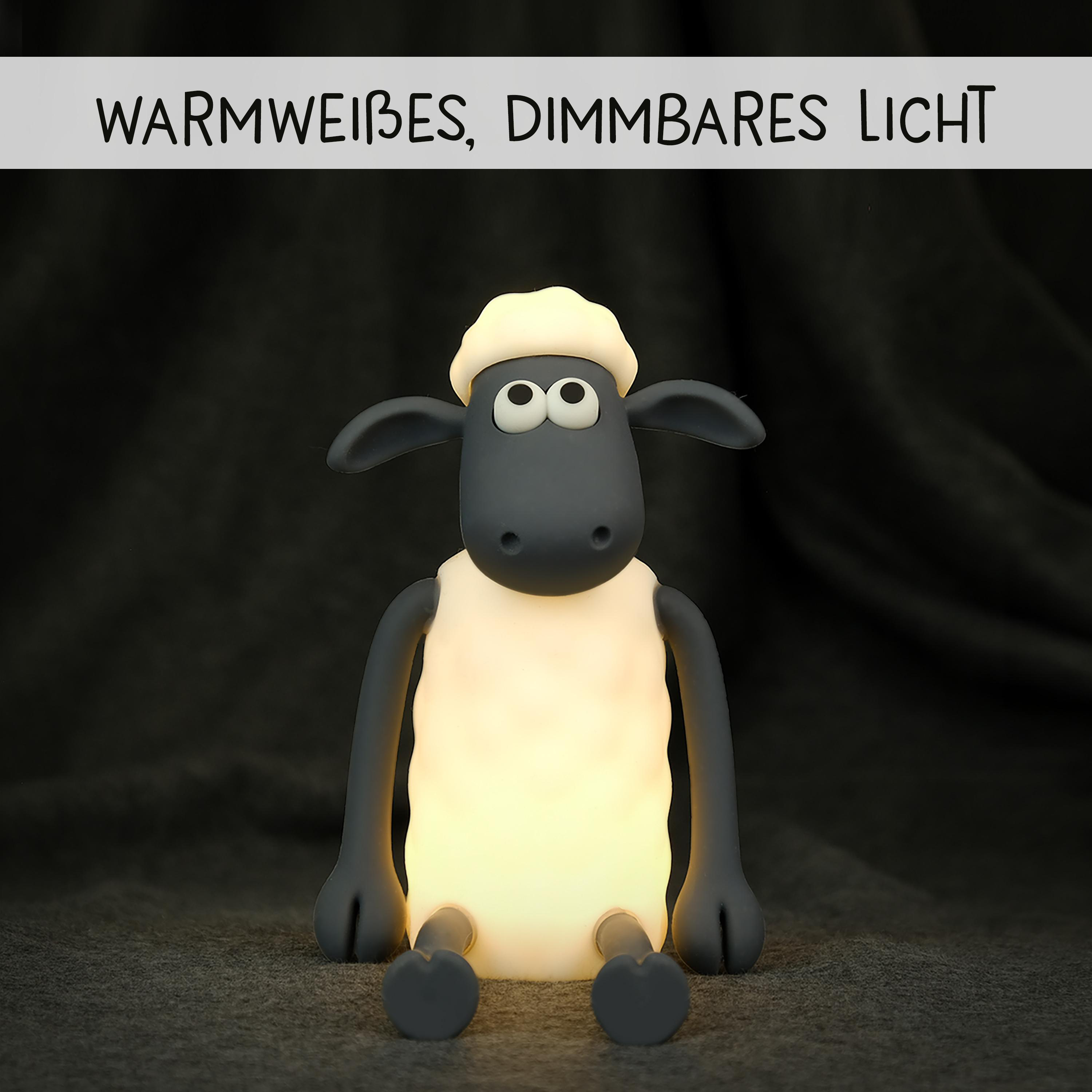 Shaun das Schaf Lampe, warmweißes Licht, sitzt auf grauem Teppich.