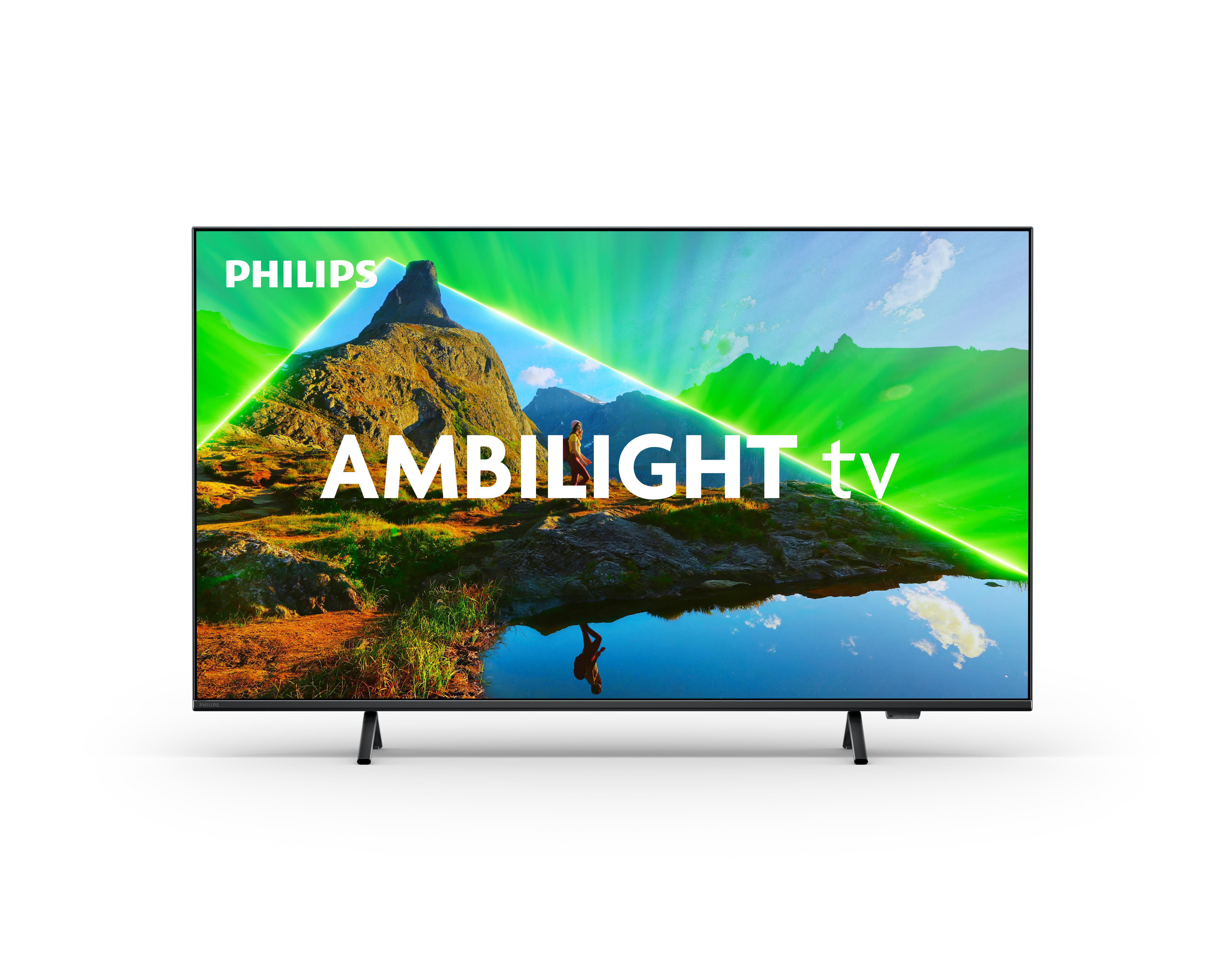 Philips Ambilight TV. Schwarzer Bildschirm mit grünem und blauem Umgebungslicht.