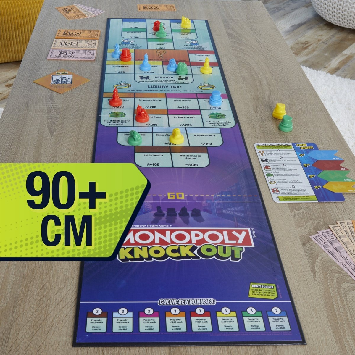 Monopoly Knock Out board game. Tokens and money are on the board. A measurement of 90+ cm is visible.