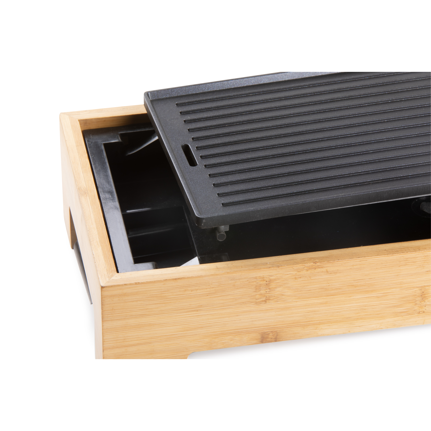 Close up of a grill, showing the removable griddle surface.