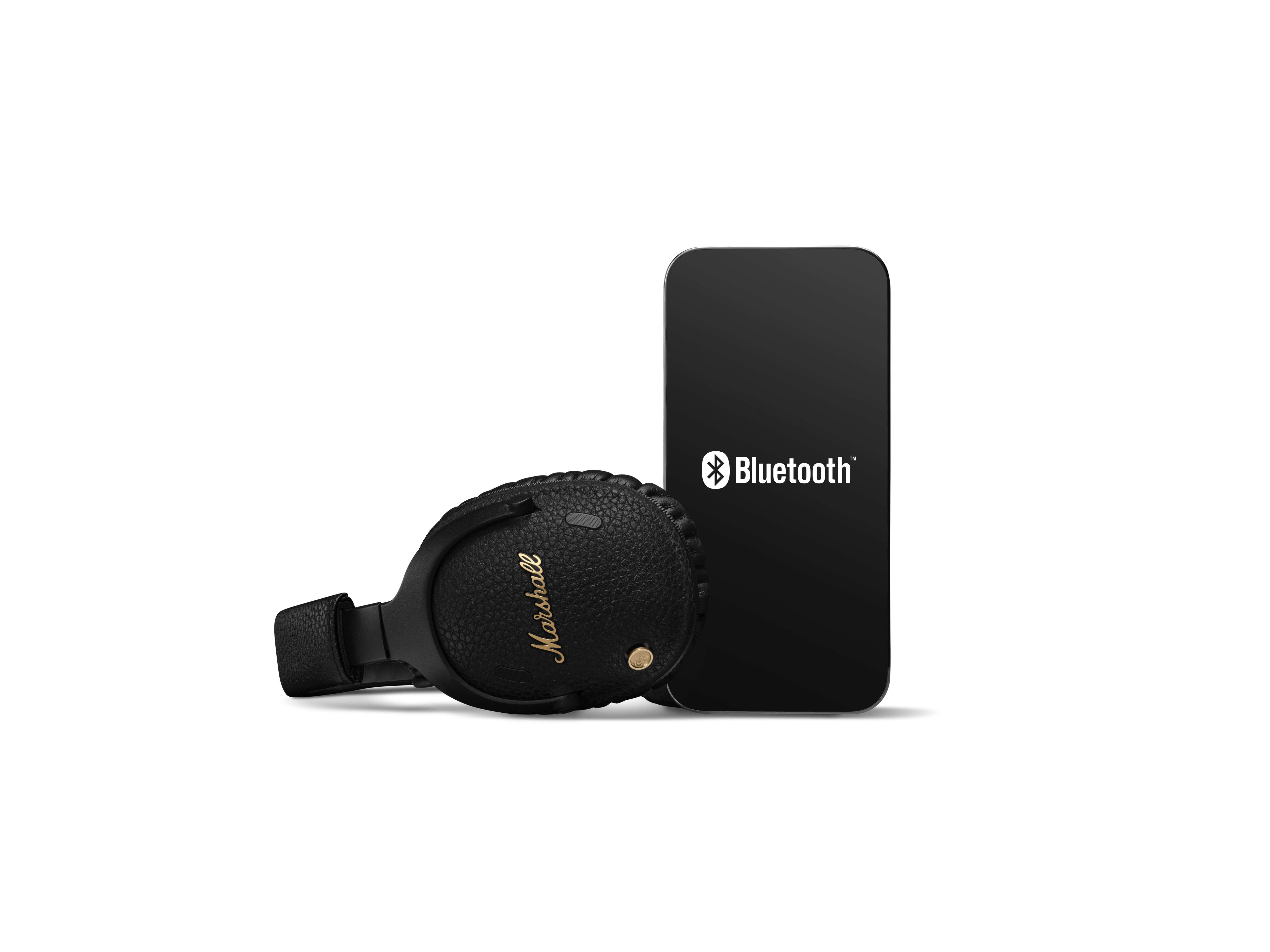 Bluetooth logosu olan bir akıllı telefonun yanında siyah Marshall kulaklıklar.