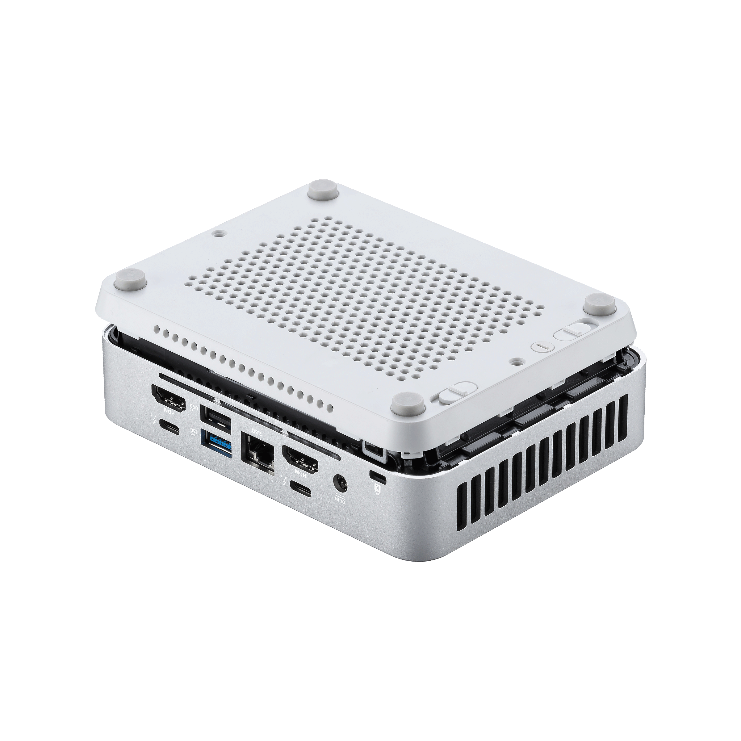 Silberner Mini-Computer mit abgenommener Abdeckung. Interne Komponenten sind sichtbar, mit perforierter Oberseite.