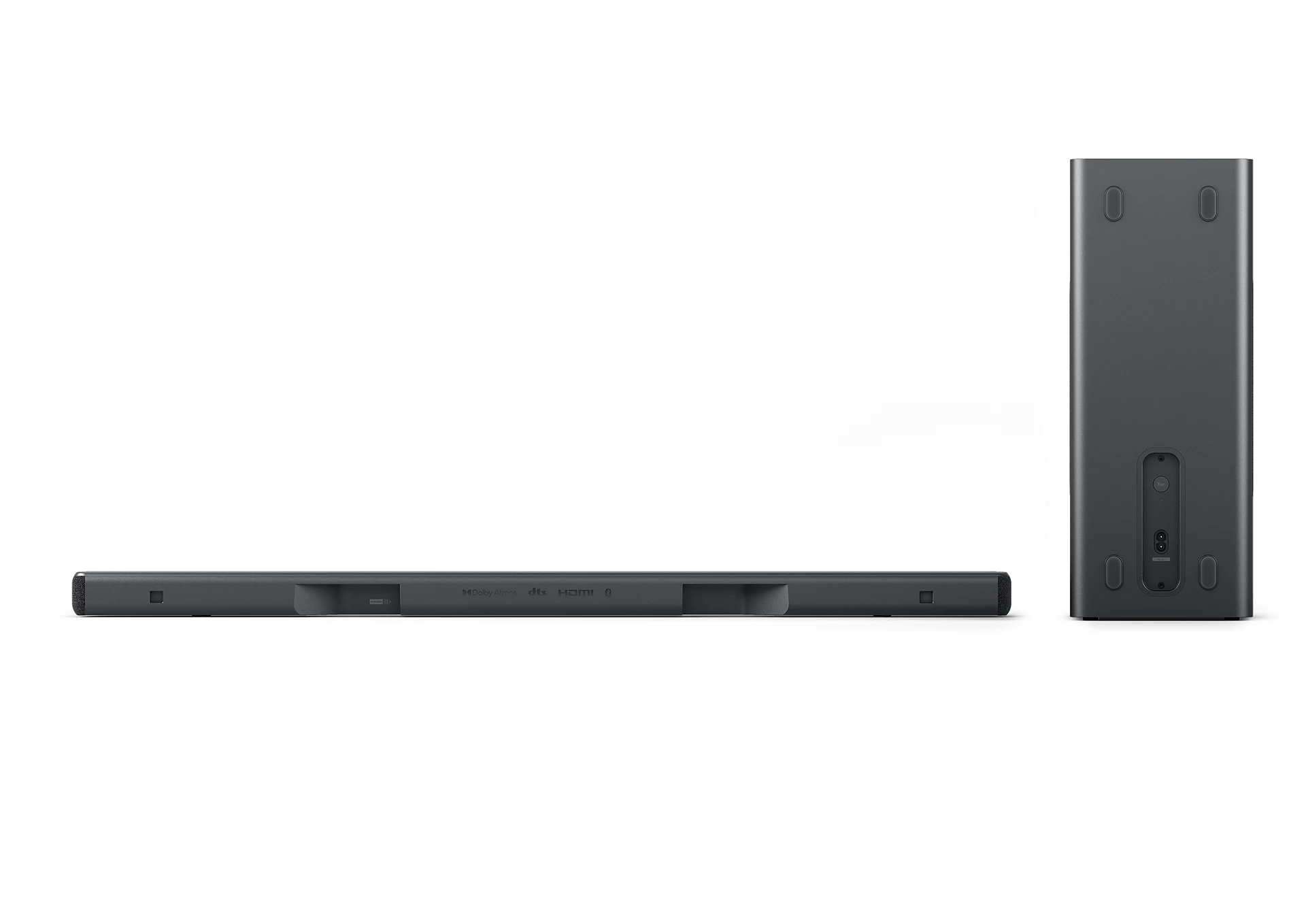 Vista trasera de una barra de sonido y subwoofer negros sobre un fondo blanco. Toma de producto.