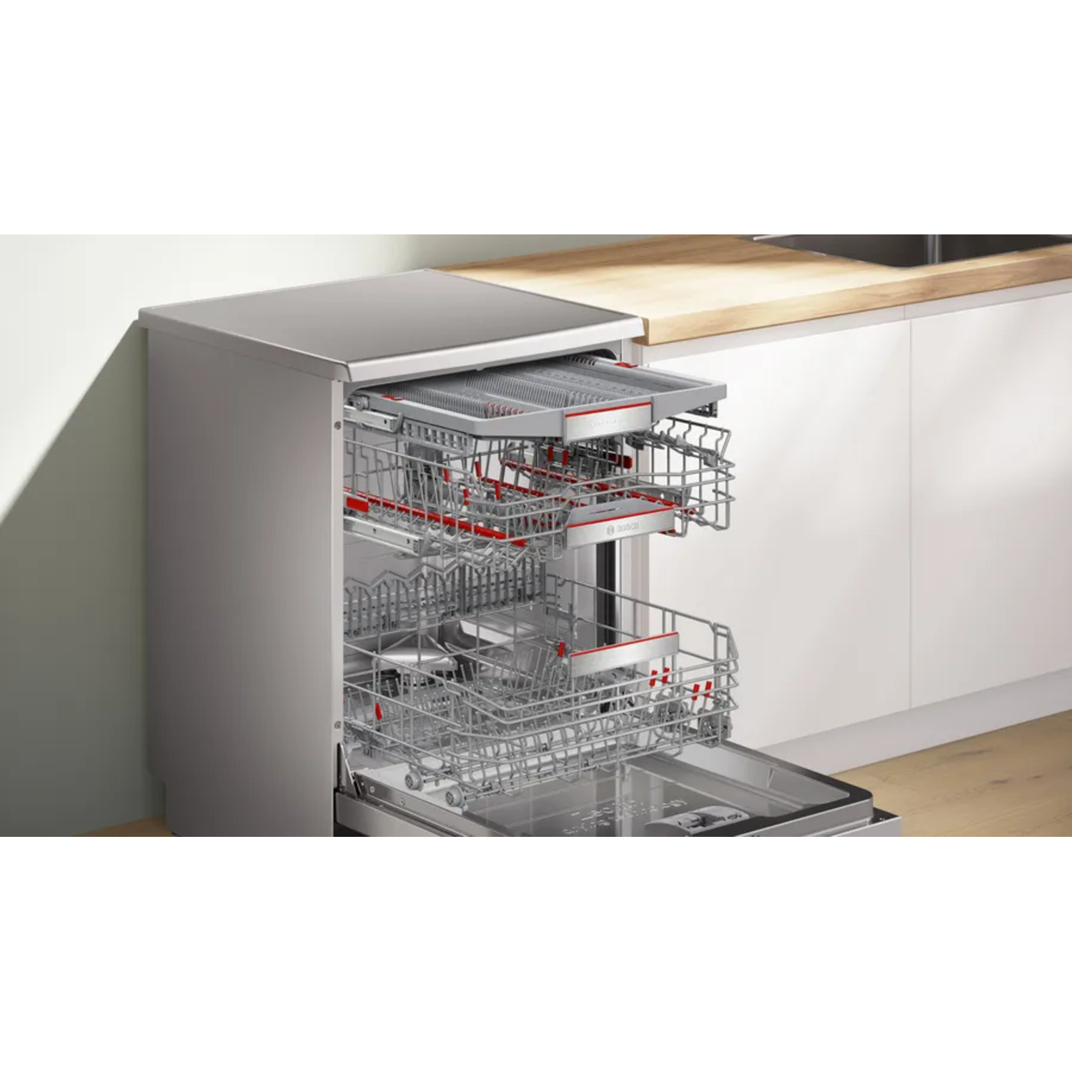 Open dishwasher with racks visible. Top rack contains a cutlery tray, bottom rack is empty.