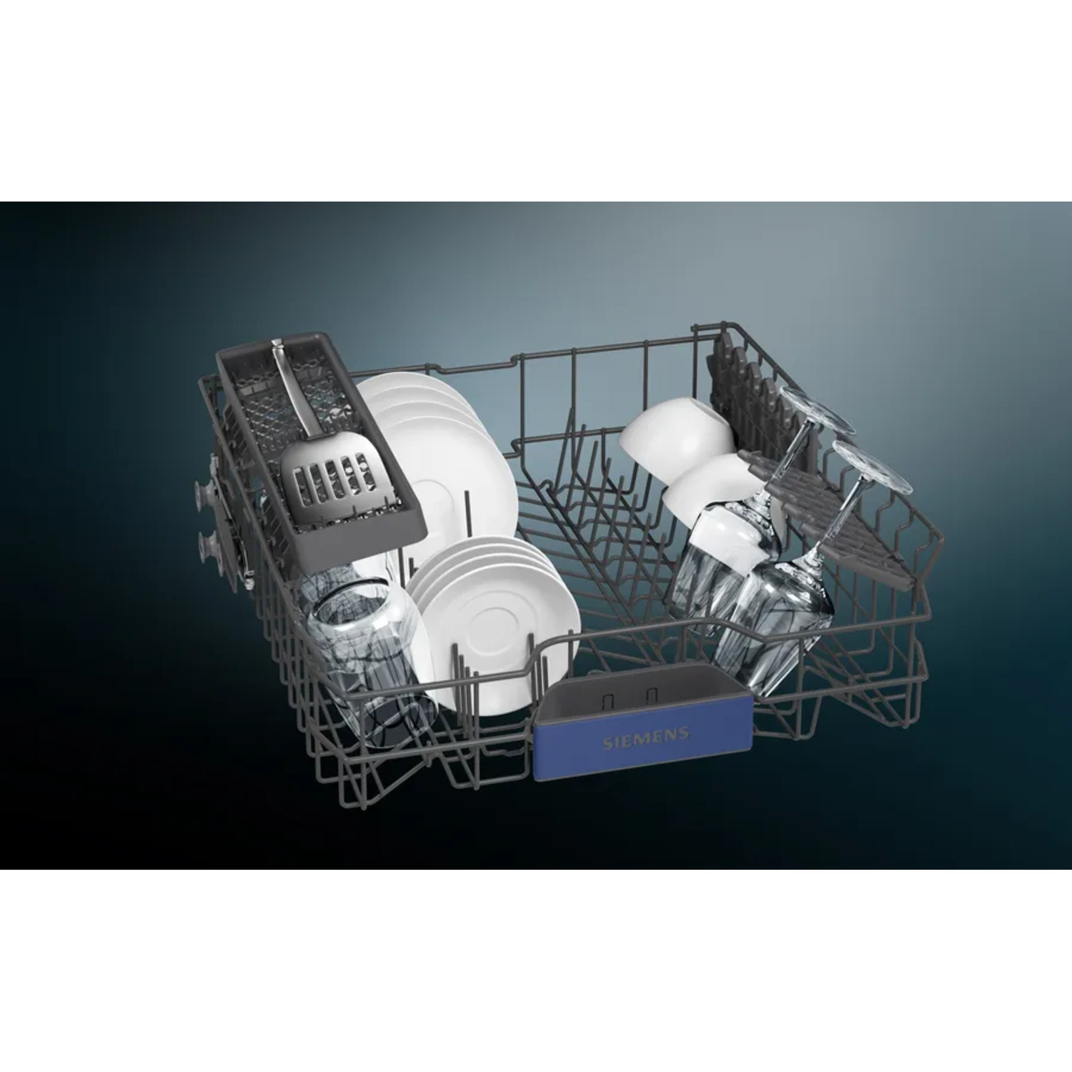 Dishwasher rack with plates, glasses and a spatula. Rack is grey, plates white, and background is dark blue.