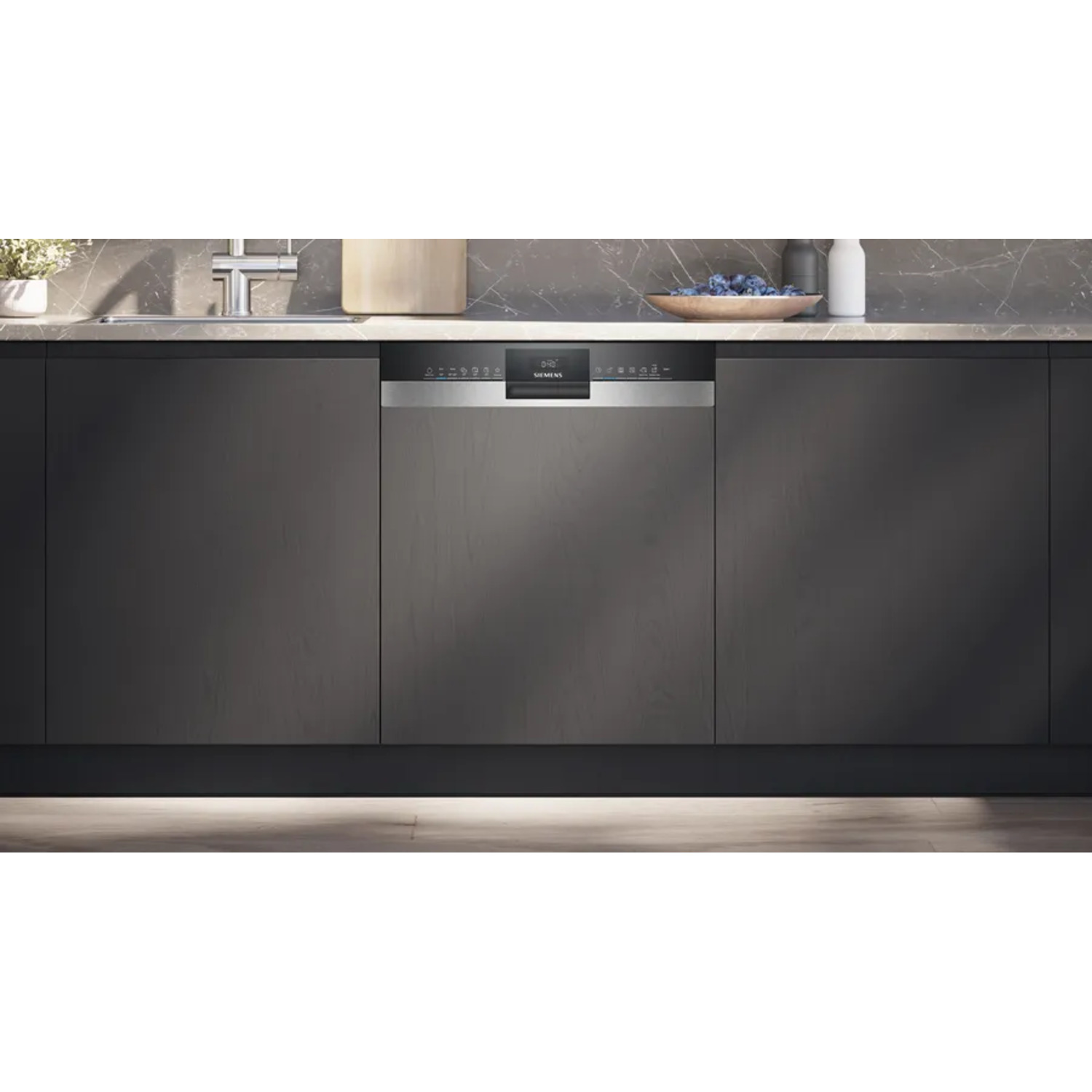 Dishwasher integrated into dark cabinets. Control panel is visible. The dishwasher door is closed. Kitchen setting.