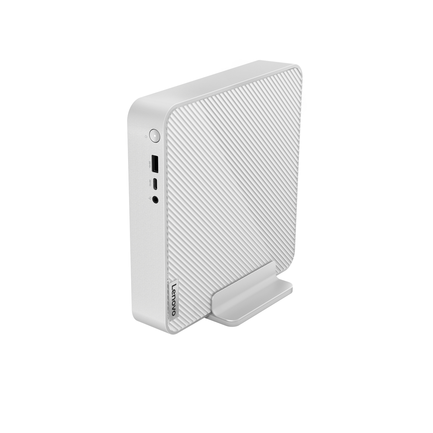Ordinateur de bureau blanc et gris sur une surface blanche, vue en angle.