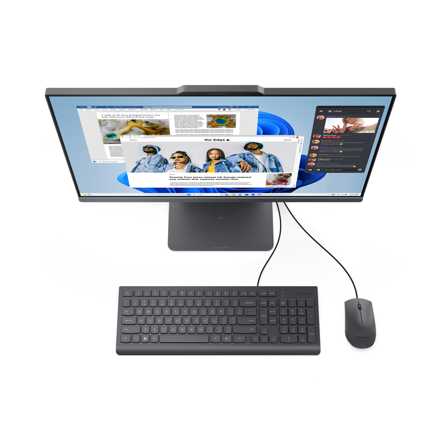 Top-down view of a dark gray monitor with keyboard and mouse. The screen displays websites.