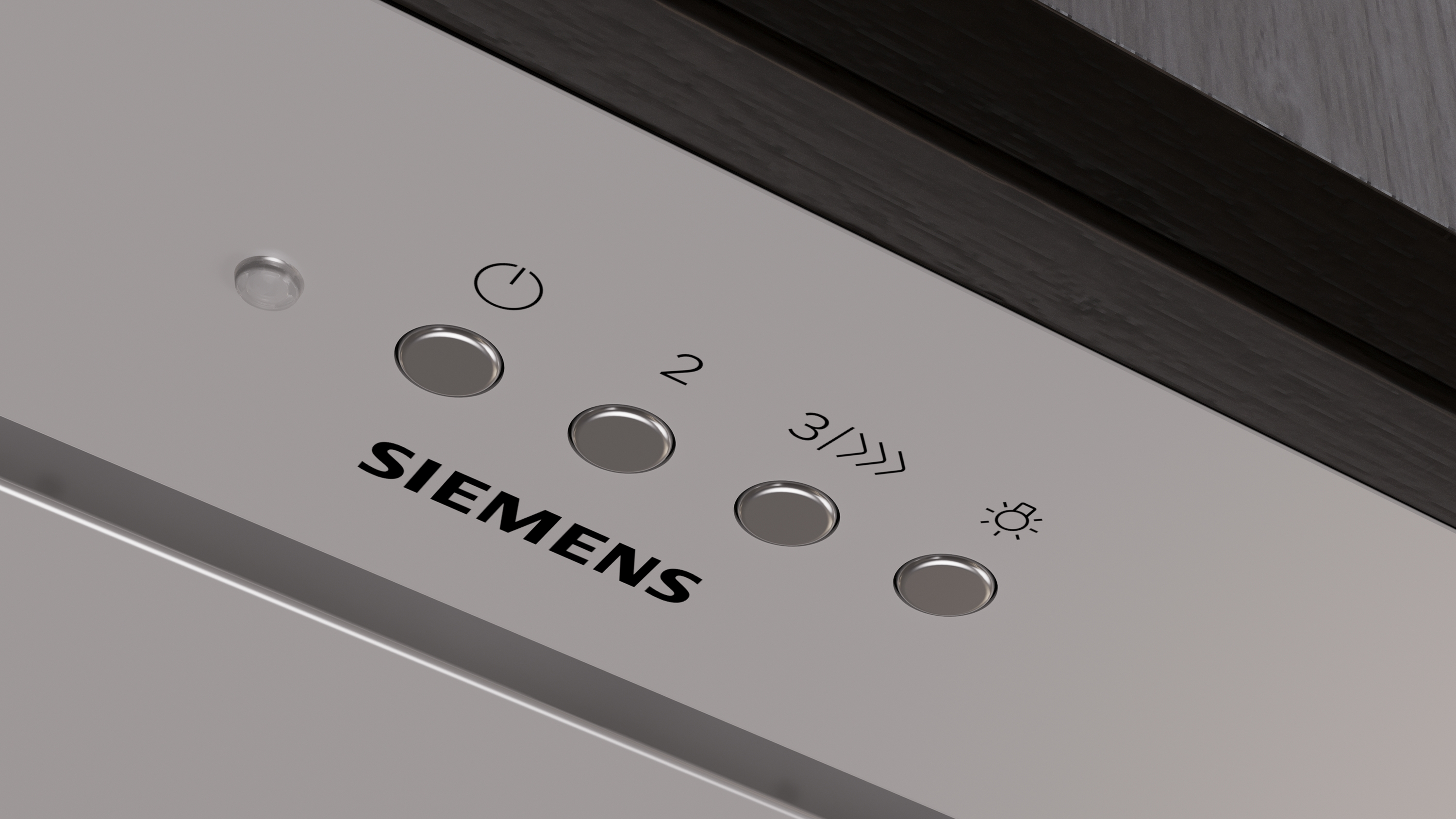Nahaufnahme eines Siemens-Gerätebedienfelds. Es hat Tasten mit Symbolen für Strom, Einstellungen und ein Licht. Der Markenname ist sichtbar.