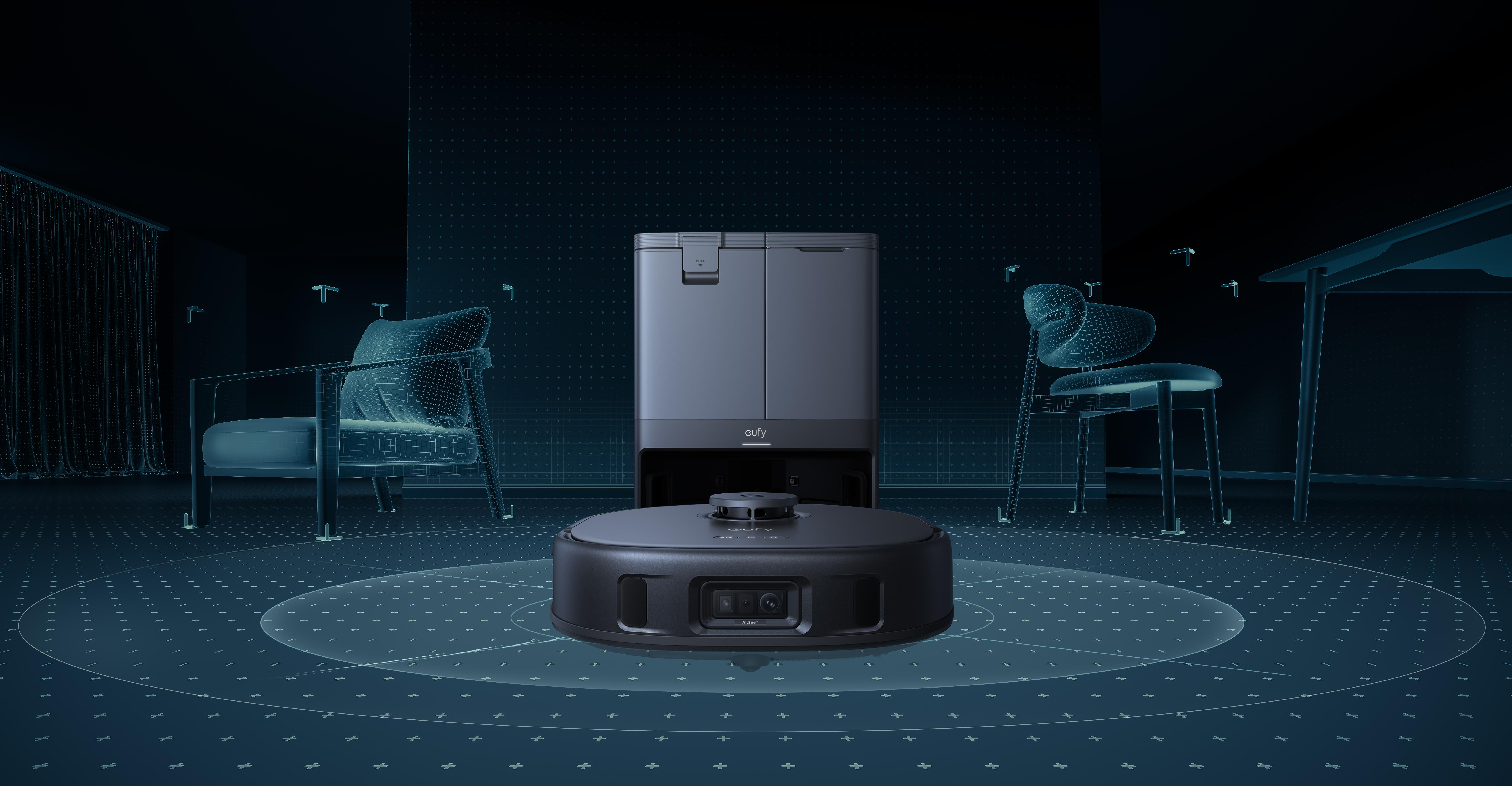 Ein schwarzer Eufy-Roboter-Staubsauger und eine Ladestation in einem blau beleuchteten Raum. Drahtgitterstühle und ein Tisch im Hintergrund.