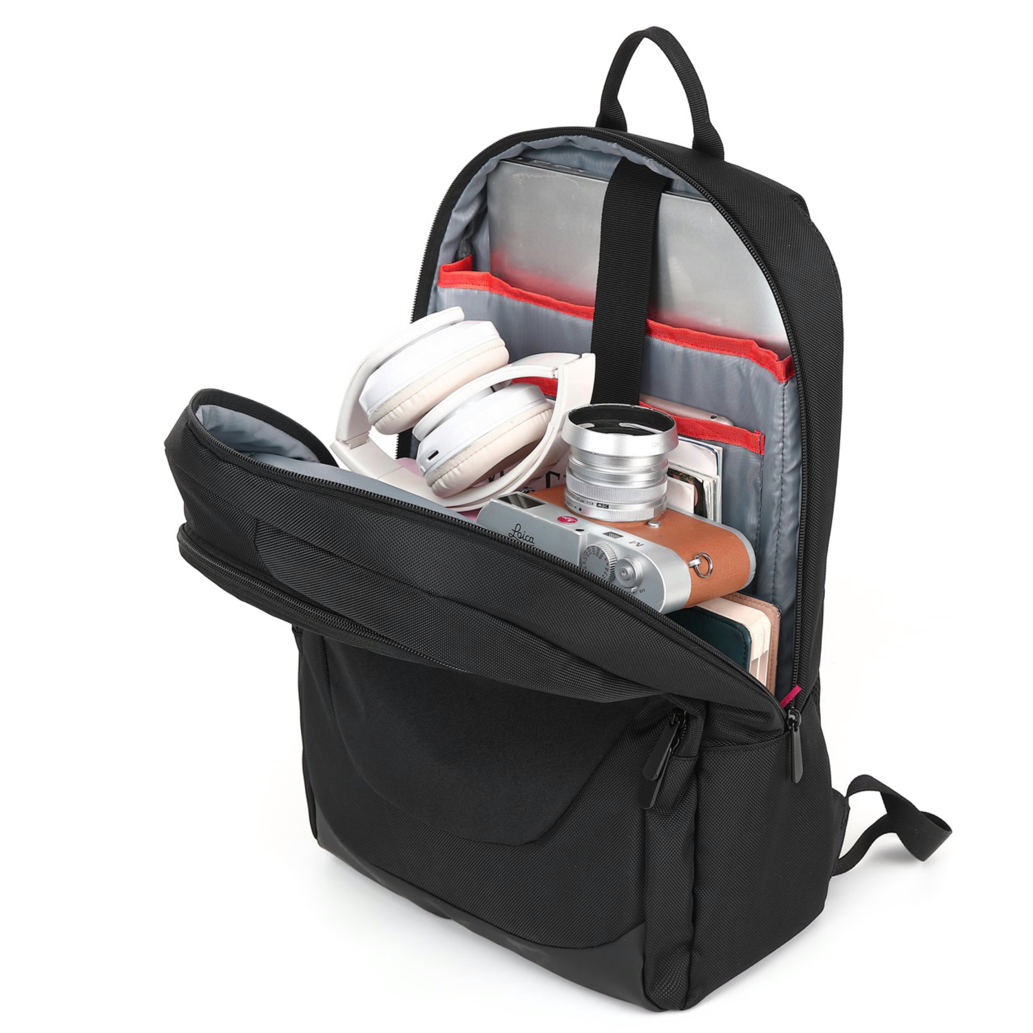 Black backpack open, showing interior with headphones, camera, and other items.