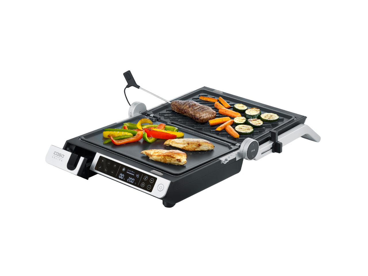 Elektrischer Grill mit gegrilltem Fleisch und Gemüse auf den Grillplatten, schwarzer Hintergrund.