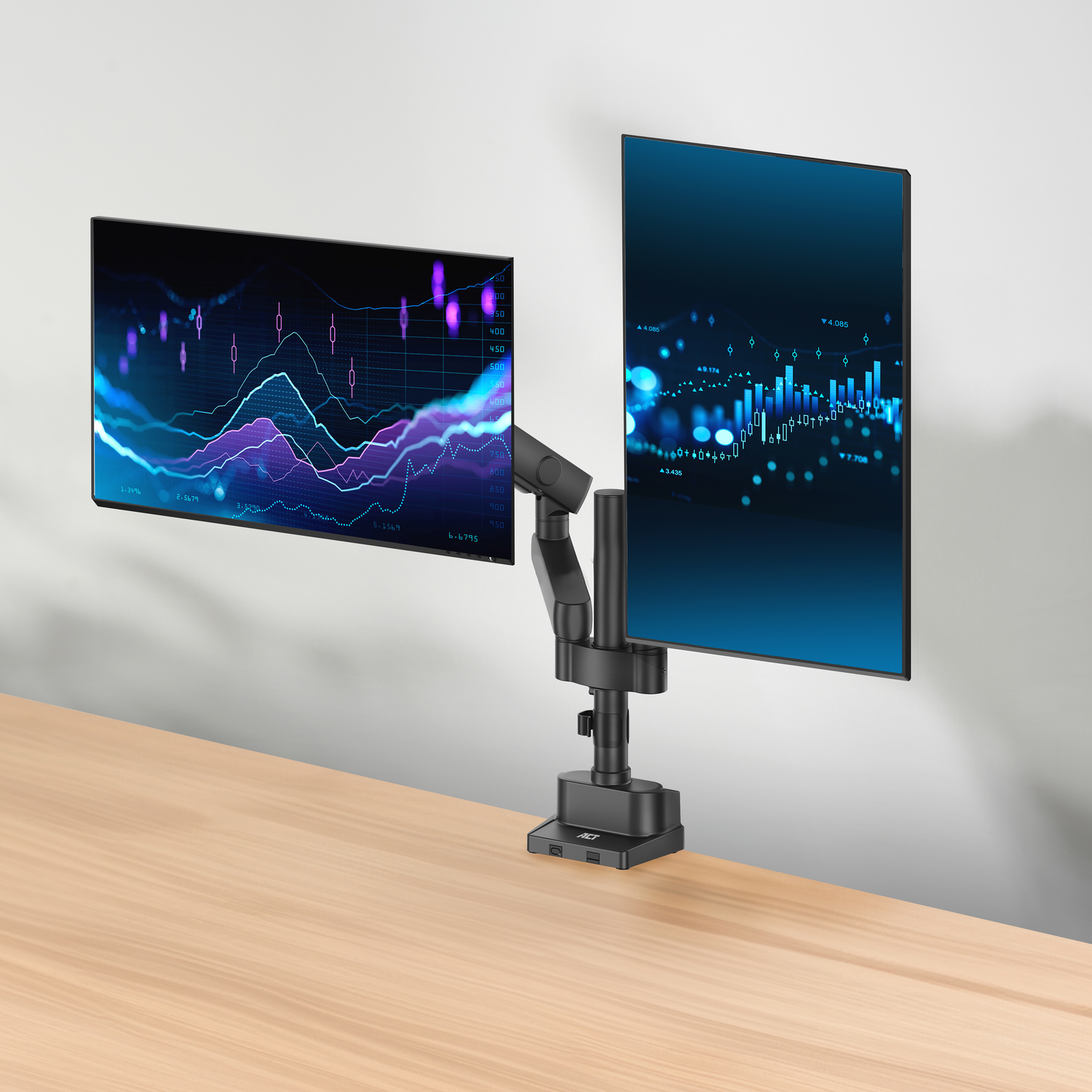 Two computer monitors on a desk, white wall background.