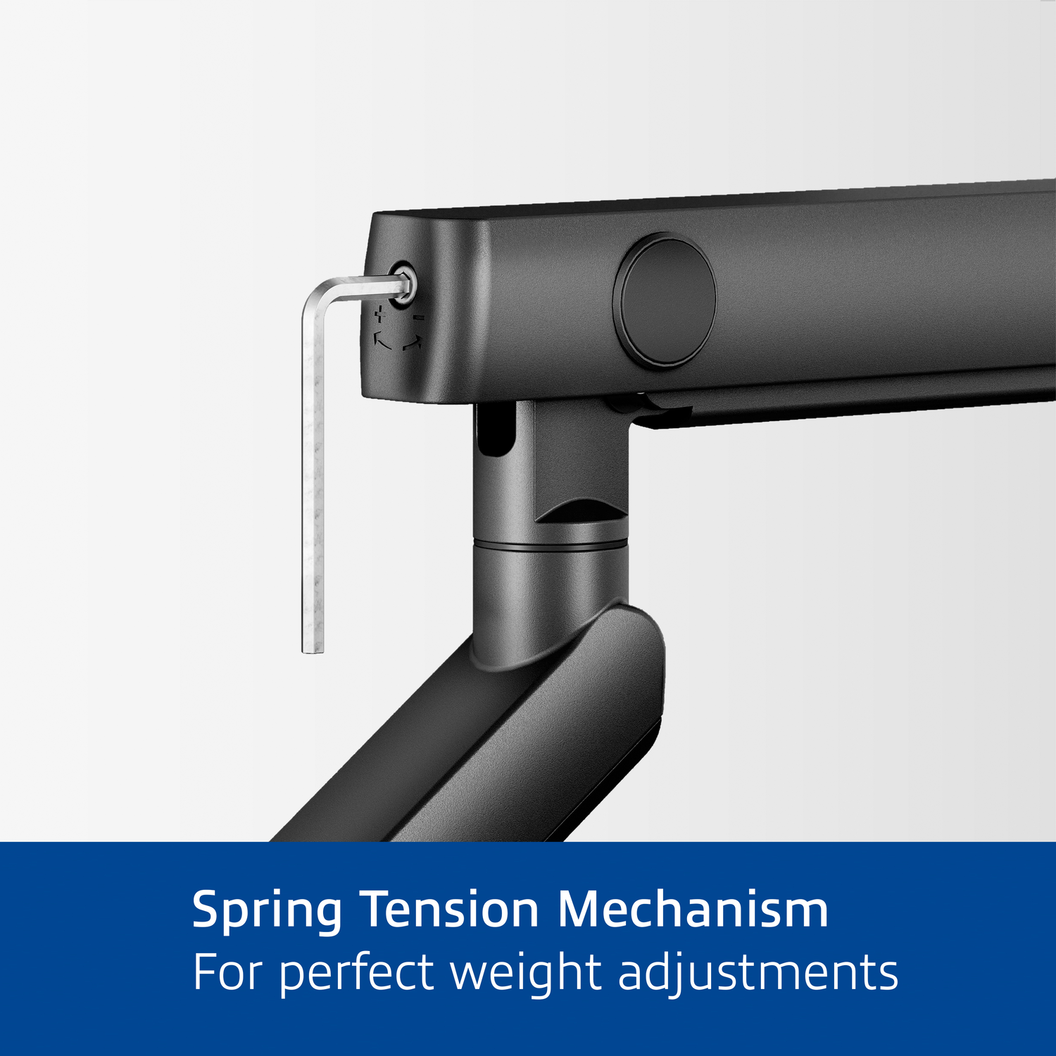 Close-up of black monitor arm joint. Hex key is inserted.