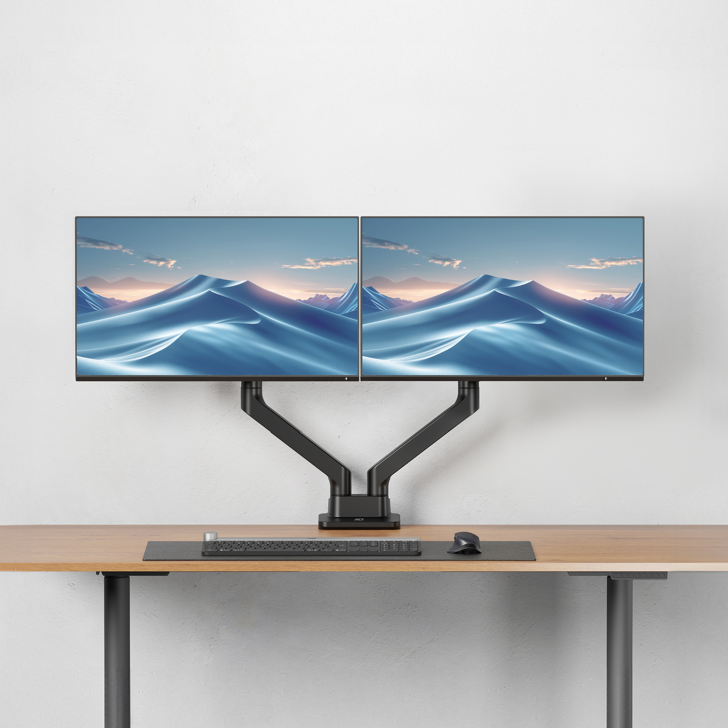 Dual monitors on a desk with a keyboard and mouse.
